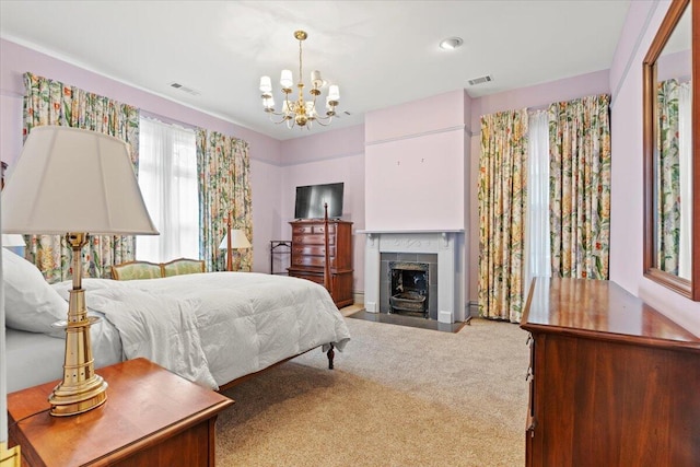 bedroom featuring carpet floors, a fireplace, and an inviting chandelier