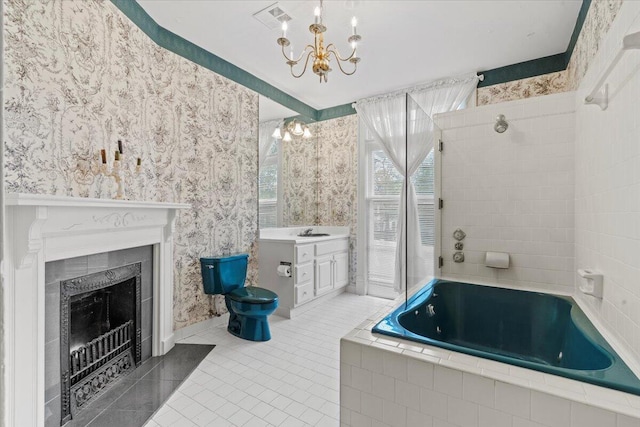 full bathroom featuring tile patterned floors, vanity, separate shower and tub, a chandelier, and toilet