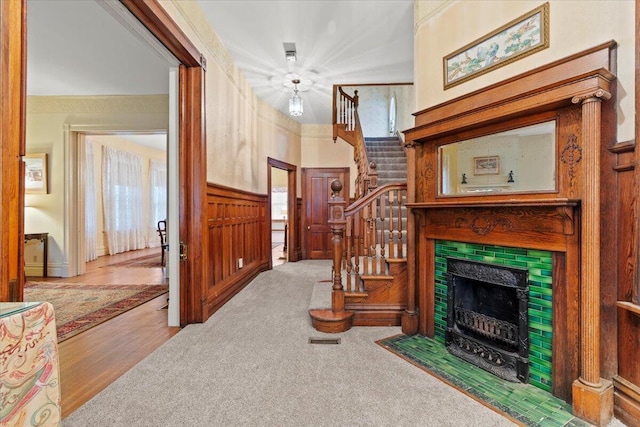 carpeted living room with a fireplace and plenty of natural light