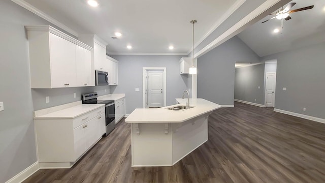 kitchen with sink, white cabinetry, hanging light fixtures, appliances with stainless steel finishes, and a kitchen island with sink