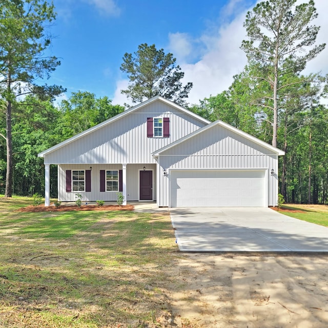 556 Hillman St, Warrenville, SC 29851 - view of front facade featuring a garage, driveway, and a front yard