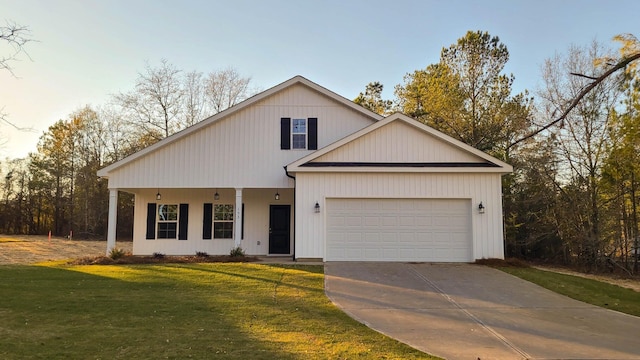 view of front of house featuring a garage and a front lawn