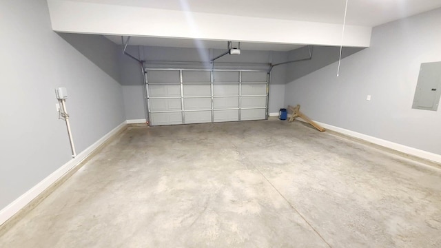 garage with a garage door opener and electric panel