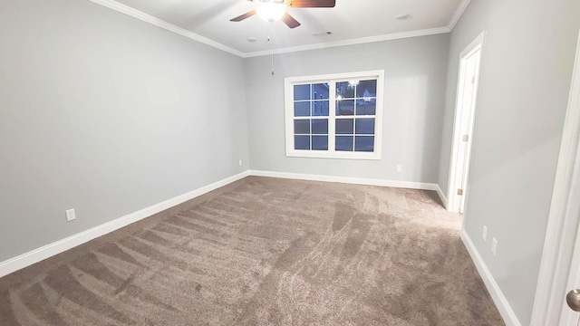 empty room with crown molding, carpet, and ceiling fan