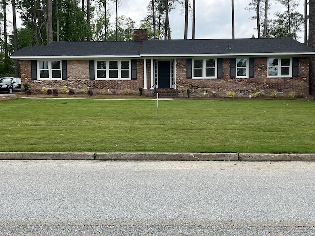 3517 Jamaica Dr, Augusta, GA 30909 - ranch-style house with brick siding, a chimney, a front lawn, crawl space, and roof with shingles