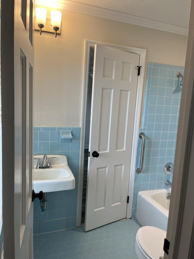 3517 Jamaica Dr, Augusta, GA 30909 - full bath featuring tile walls, crown molding, shower / bath combination, tile patterned flooring, and wainscoting