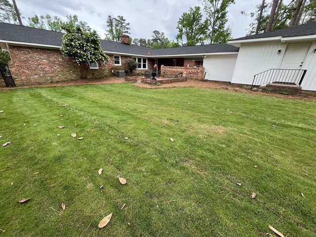 3517 Jamaica Dr, Augusta, GA 30909 - view of green lawn with a patio area