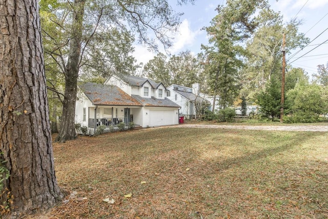 view of front of property with covered porch and a front yard