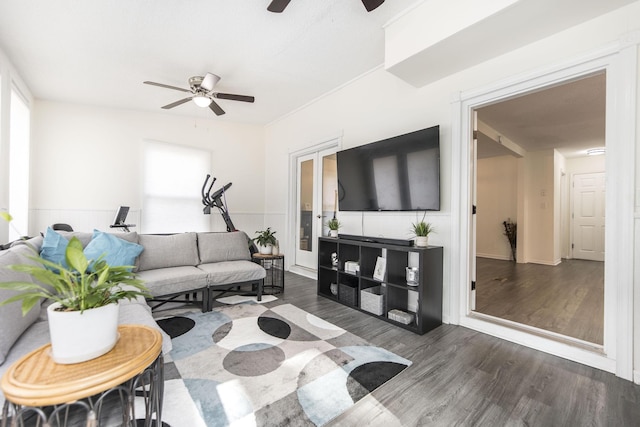 living room with dark hardwood / wood-style floors and ceiling fan