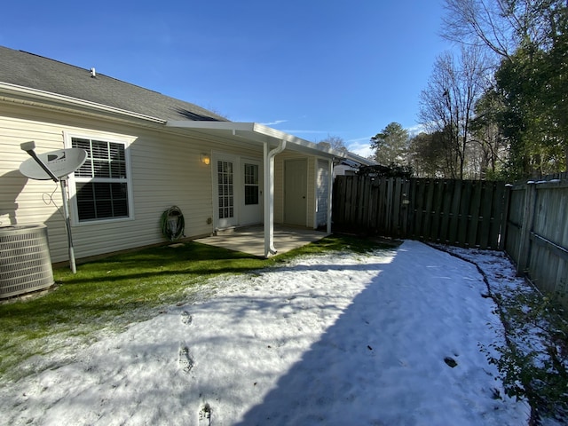 view of yard with central air condition unit and a patio area