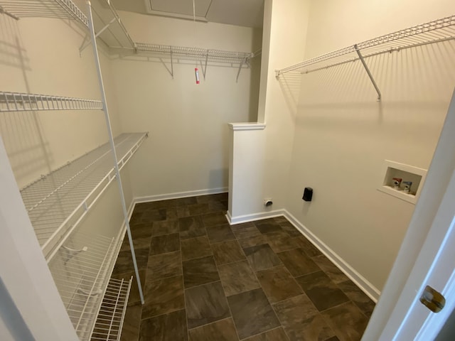 laundry area with hookup for a washing machine and hookup for an electric dryer