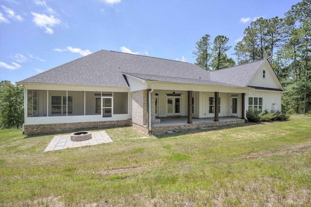 110 Collin Reeds Rd, North Augusta, SC 29860 - rear view of house featuring a fire pit, a shingled roof, a patio area, a lawn, and brick siding