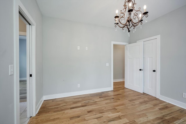 110 Collin Reeds Rd, North Augusta, SC 29860 - unfurnished dining area featuring a chandelier, light wood finished floors, and baseboards