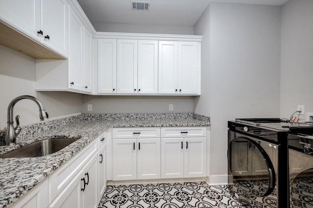110 Collin Reeds Rd, North Augusta, SC 29860 - kitchen with a sink, white cabinetry, and light stone countertops