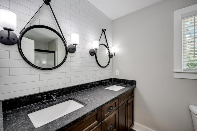 110 Collin Reeds Rd, North Augusta, SC 29860 - full bathroom with backsplash, double vanity, baseboards, and toilet