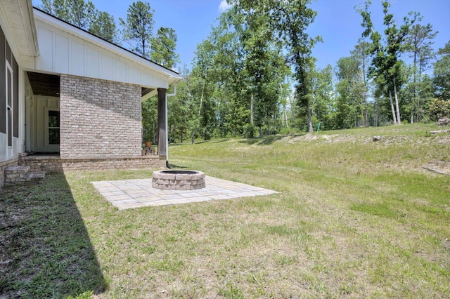 110 Collin Reeds Rd, North Augusta, SC 29860 - view of grassy yard featuring a fire pit and a patio area