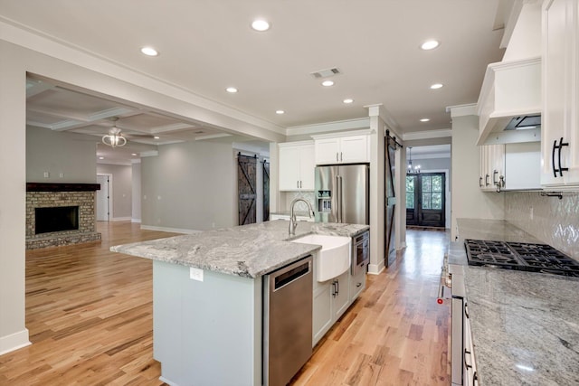 110 Collin Reeds Rd, North Augusta, SC 29860 - kitchen featuring appliances with stainless steel finishes, a sink, baseboards, ornamental molding, and tasteful backsplash