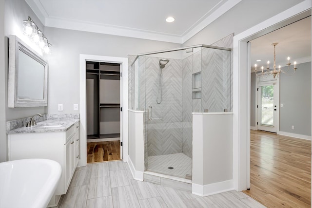 110 Collin Reeds Rd, North Augusta, SC 29860 - full bath with vanity, a stall shower, a chandelier, a freestanding tub, and crown molding