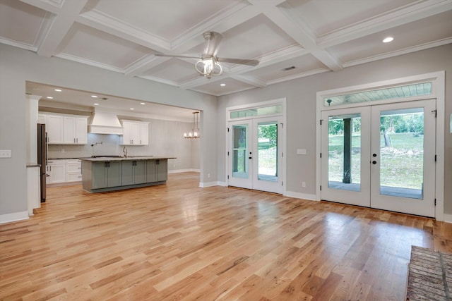 110 Collin Reeds Rd, North Augusta, SC 29860 - unfurnished living room featuring french doors, coffered ceiling, ceiling fan, light wood-style flooring, and beamed ceiling