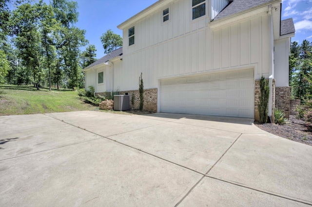 110 Collin Reeds Rd, North Augusta, SC 29860 - view of property exterior with roof with shingles, board and batten siding, concrete driveway, and central AC unit