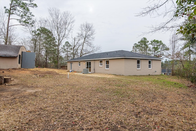 back of house featuring central AC