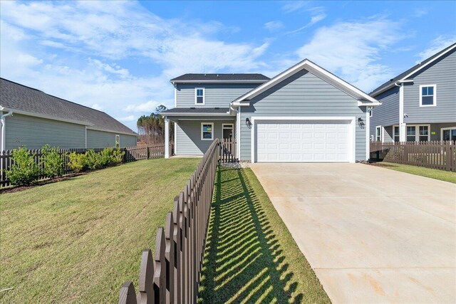 view of front facade with a garage and a front lawn