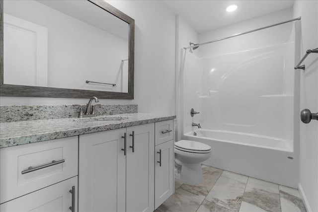 full bathroom featuring vanity, washtub / shower combination, and toilet