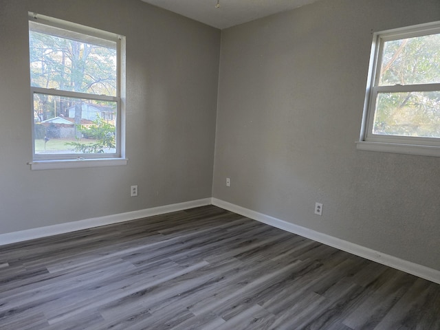 unfurnished room featuring dark hardwood / wood-style floors