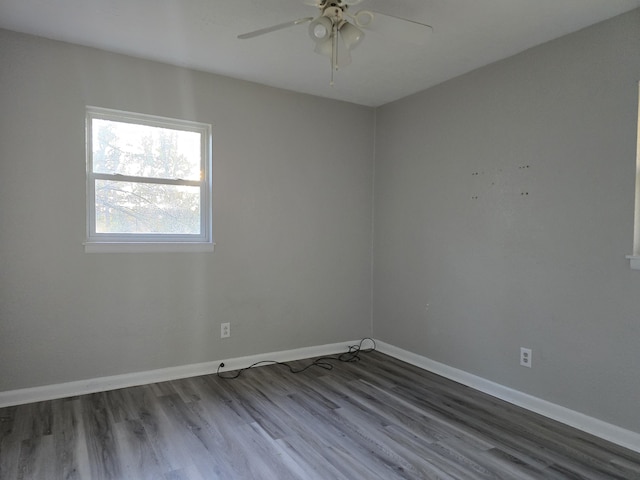 spare room featuring hardwood / wood-style floors and ceiling fan