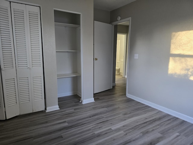 unfurnished bedroom with hardwood / wood-style flooring