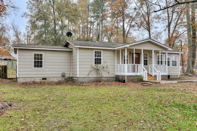 view of front of property with a front lawn and covered porch