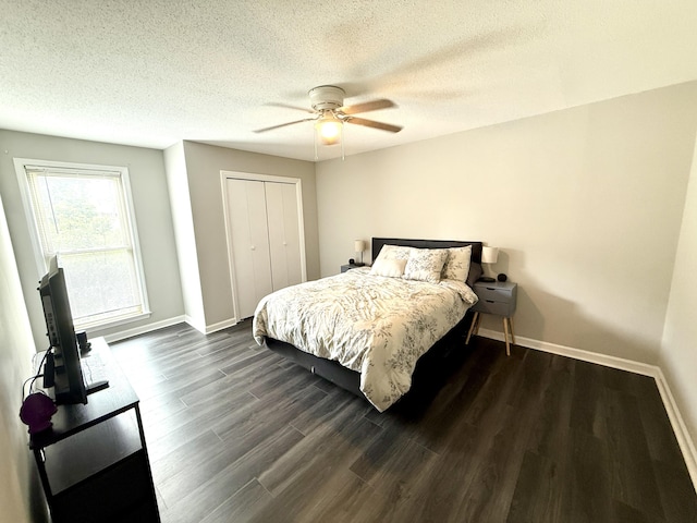 231 Norma Ln, Evans, GA 30809 - bedroom with a textured ceiling, a closet, dark wood-style floors, baseboards, and ceiling fan