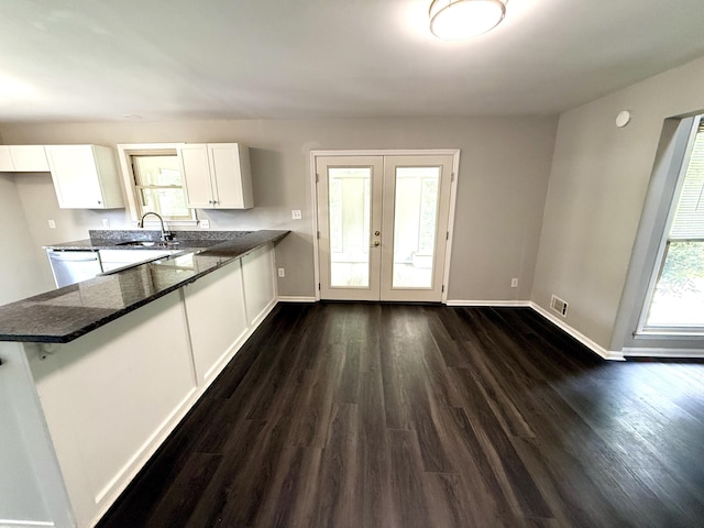 231 Norma Ln, Evans, GA 30809 - kitchen with white cabinetry, dark wood-style floors, baseboards, and french doors