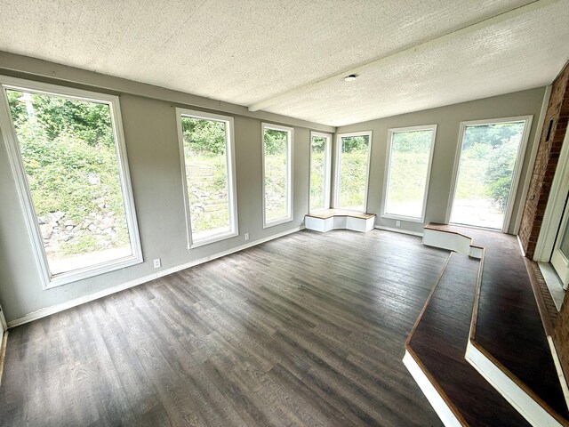 231 Norma Ln, Evans, GA 30809 - unfurnished sunroom featuring healthy amount of natural light, wood finished floors, a textured ceiling, and baseboards