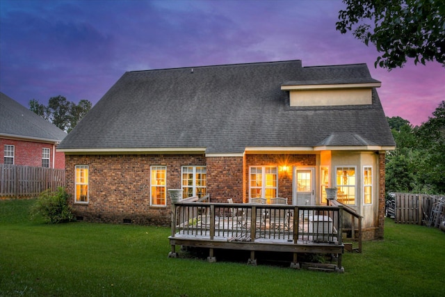 322 Farmington Dr, Evans, GA 30809 - back of house at dusk featuring a deck, crawl space, a shingled roof, and brick siding