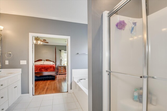 322 Farmington Dr, Evans, GA 30809 - full bathroom with ensuite bath, vanity, a stall shower, a garden tub, and tile patterned flooring