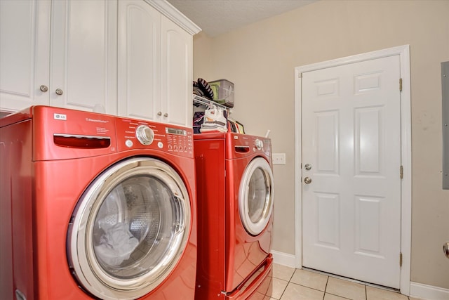 322 Farmington Dr, Evans, GA 30809 - laundry room with washing machine and clothes dryer, cabinet space, light tile patterned flooring, and baseboards