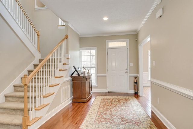 322 Farmington Dr, Evans, GA 30809 - entryway featuring wood finished floors, stairs, ornamental molding, and recessed lighting