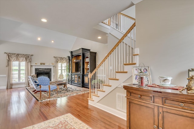 322 Farmington Dr, Evans, GA 30809 - living area with light wood-style flooring, stairway, baseboards, a premium fireplace, and recessed lighting