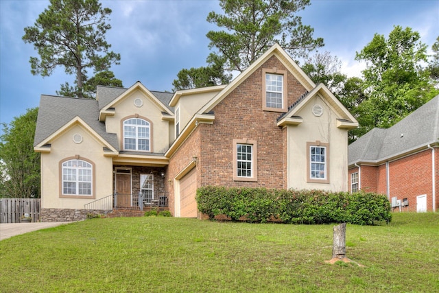 322 Farmington Dr, Evans, GA 30809 - traditional home with stucco siding, a garage, and brick siding