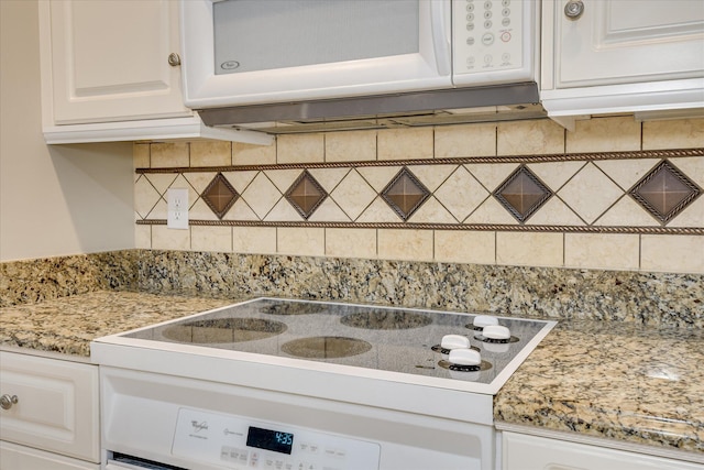322 Farmington Dr, Evans, GA 30809 - kitchen view of white microwave, white cabinetry, tasteful backsplash, electric stovetop, and stove