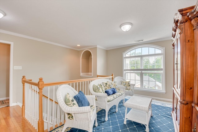 322 Farmington Dr, Evans, GA 30809 - living area featuring crown molding, baseboards, an upstairs landing, and wood finished floors