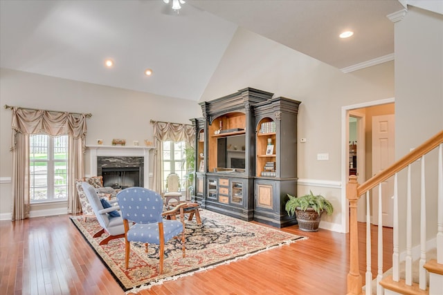 322 Farmington Dr, Evans, GA 30809 - living room featuring wood finished floors, vaulted ceiling, stairs, a high end fireplace, and baseboards