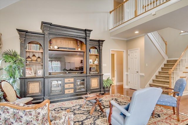 322 Farmington Dr, Evans, GA 30809 - living room with a high ceiling, stairs, and wood finished floors