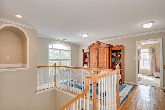 322 Farmington Dr, Evans, GA 30809 - hallway with an upstairs landing, plenty of natural light, light wood-style flooring, baseboards, and crown molding