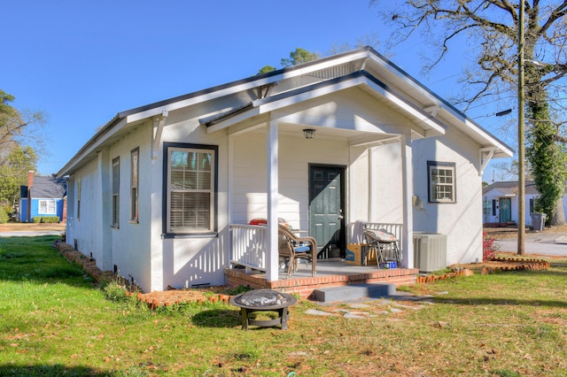 1321 Holden St, Augusta, GA 30904 - rear view of house featuring a lawn, stucco siding, and covered porch