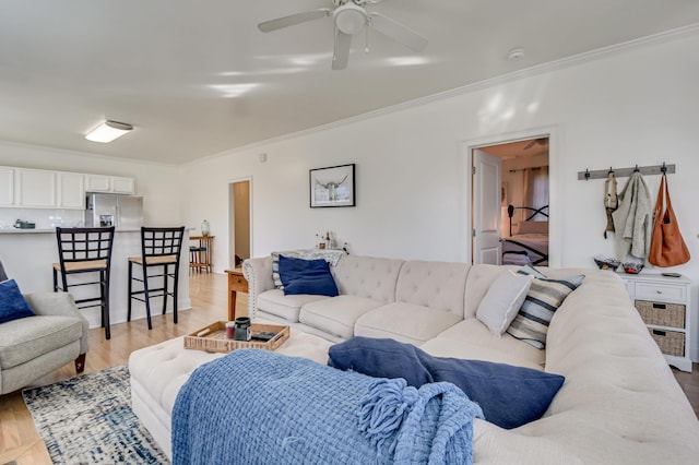 1321 Holden St, Augusta, GA 30904 - living room with crown molding, a ceiling fan, and light wood finished floors