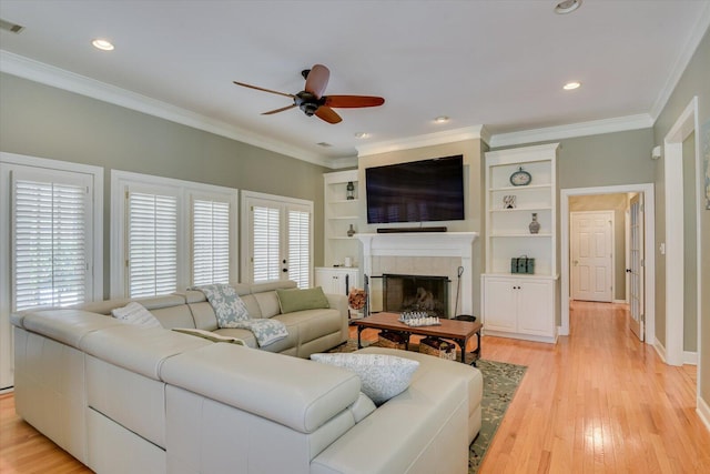 5407 Kiokee Ridge Rd, Evans, GA 30809 - living room featuring ceiling fan, ornamental molding, light wood finished floors, and a fireplace