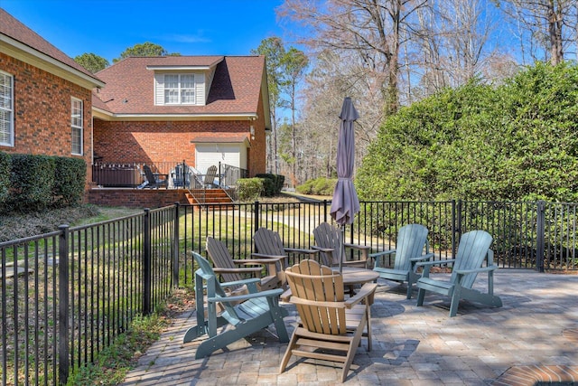 5407 Kiokee Ridge Rd, Evans, GA 30809 - view of patio / terrace with an attached garage, fence, and an outdoor fire pit