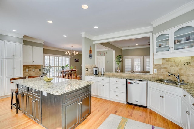 5407 Kiokee Ridge Rd, Evans, GA 30809 - kitchen with a sink, white cabinetry, tasteful backsplash, stainless steel dishwasher, and glass insert cabinets